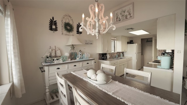 dining space with a notable chandelier