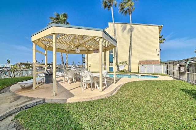 exterior space with a fenced in pool and a pergola