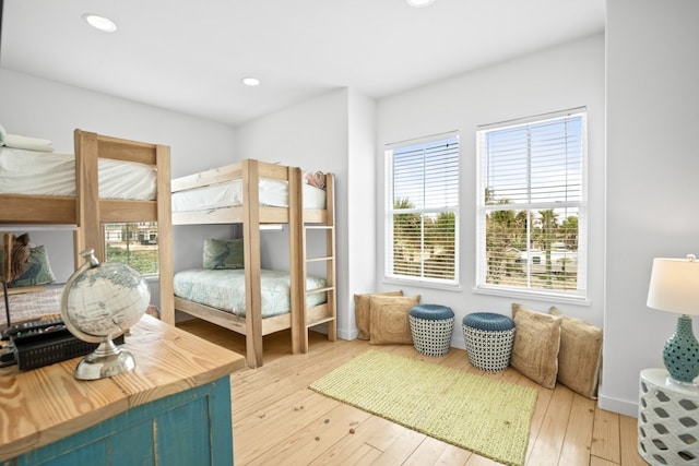 bedroom with hardwood / wood-style flooring