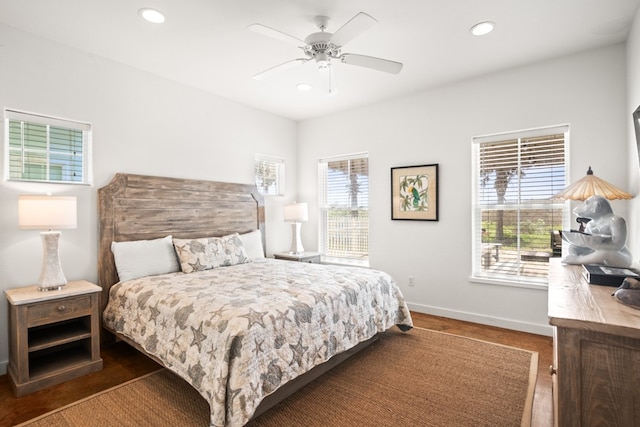 bedroom featuring dark hardwood / wood-style flooring and ceiling fan