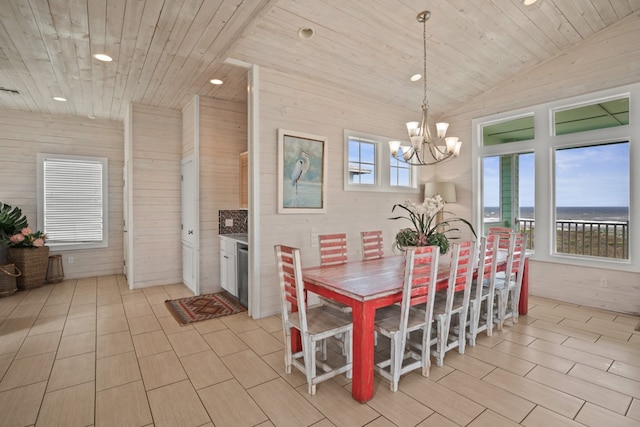 dining area featuring a healthy amount of sunlight, a water view, vaulted ceiling, and wood ceiling