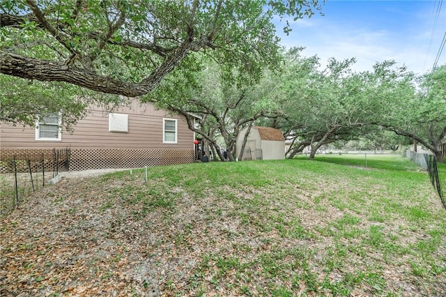245 Griffith Dr, Rockport, TX 78382 - view of yard with a storage shed, an outdoor structure, and a fenced backyard