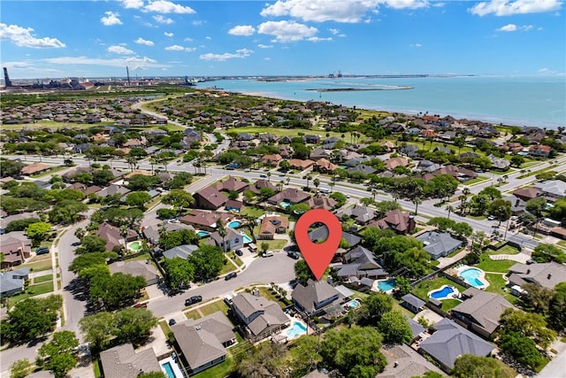 drone / aerial view featuring a water view and a residential view