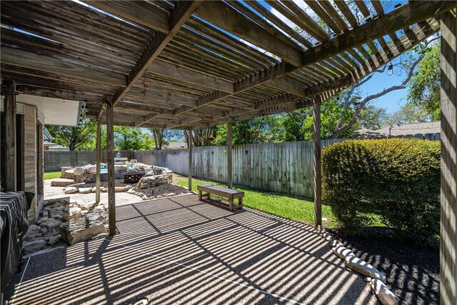 view of patio / terrace featuring a fenced backyard and a pergola