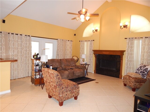 living room with high vaulted ceiling, light tile patterned flooring, and ceiling fan