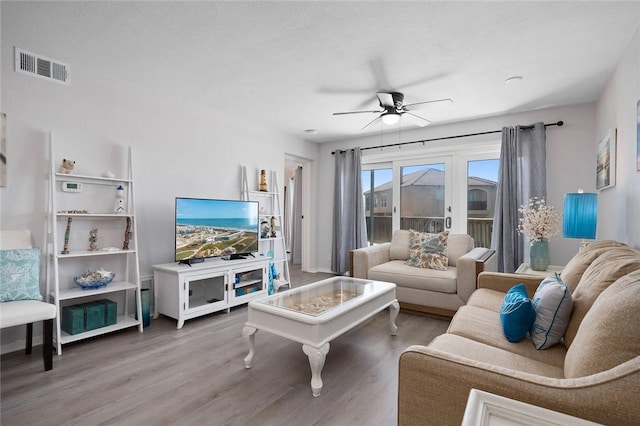 5973 State Highway 361 Unit 123, Port Aransas, TX 78373 - living area with ceiling fan and wood finished floors