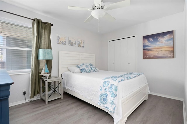 5973 State Highway 361 Unit 123, Port Aransas, TX 78373 - bedroom featuring wood finished floors, a closet, and a ceiling fan