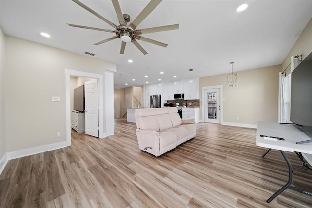 738 Crown Hbr, Corpus Christi, TX 78402 - unfurnished living room with light wood-type flooring, baseboards, visible vents, ceiling fan, and recessed lighting