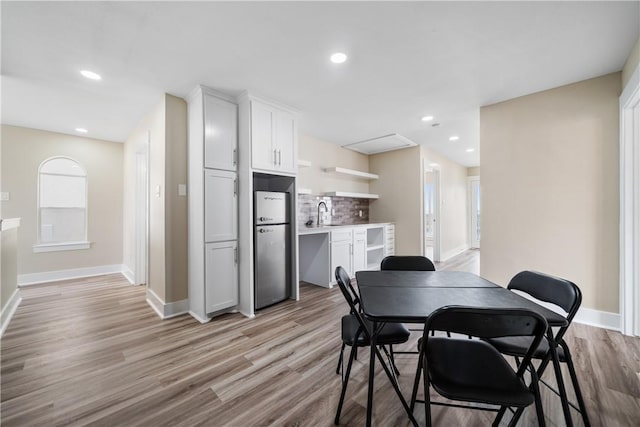 738 Crown Hbr, Corpus Christi, TX 78402 - dining space with baseboards, recessed lighting, and light wood-style floors