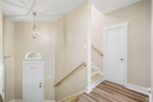 738 Crown Hbr, Corpus Christi, TX 78402 - foyer entrance featuring a notable chandelier, baseboards, and light wood finished floors
