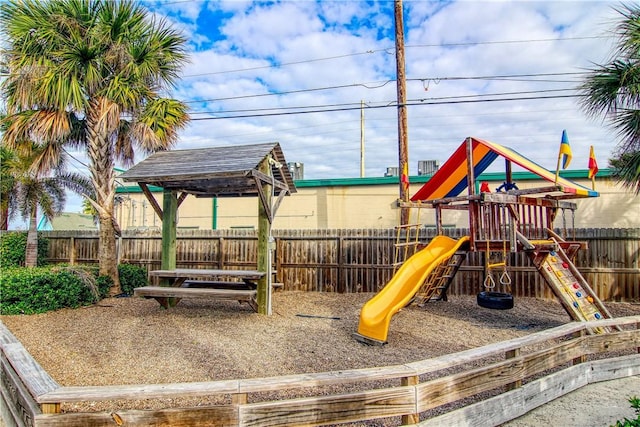 view of playground with a fenced backyard