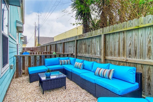 view of patio featuring an outdoor hangout area and fence