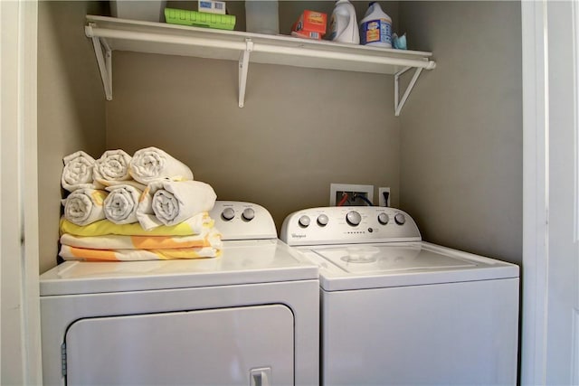 washroom with laundry area and independent washer and dryer