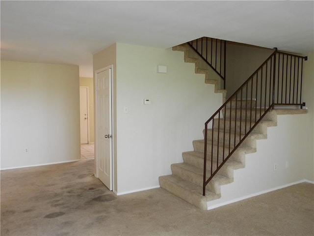 4401 River Valley Dr, Corpus Christi, TX 78410 - staircase featuring carpet floors