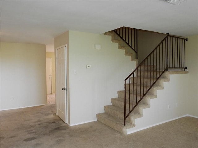 4401 River Valley Dr, Corpus Christi, TX 78410 - staircase featuring carpet floors and baseboards