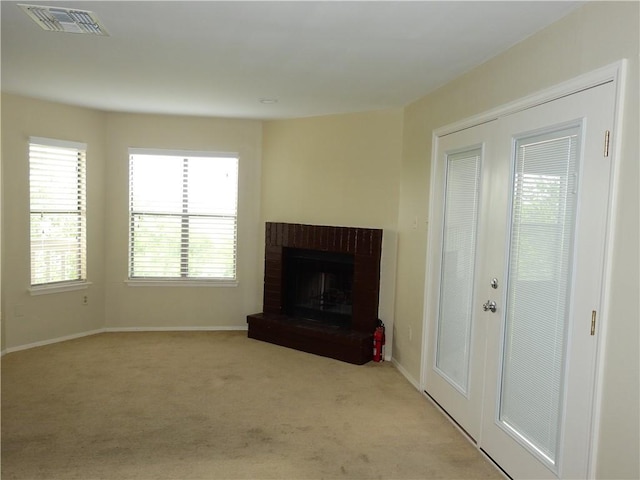 4401 River Valley Dr, Corpus Christi, TX 78410 - unfurnished living room featuring carpet flooring, healthy amount of natural light, and a fireplace