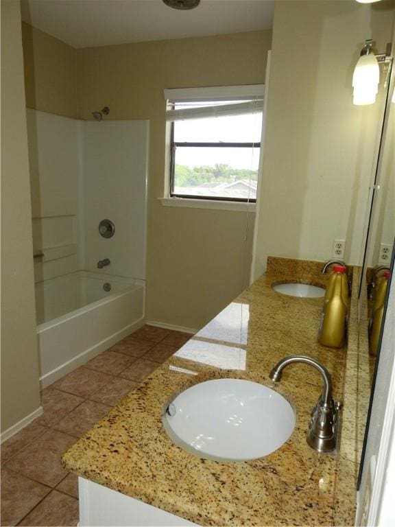 4401 River Valley Dr, Corpus Christi, TX 78410 - full bath featuring double vanity, tile patterned flooring, and  shower combination