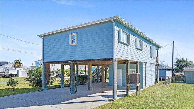 exterior space with a front lawn and a carport