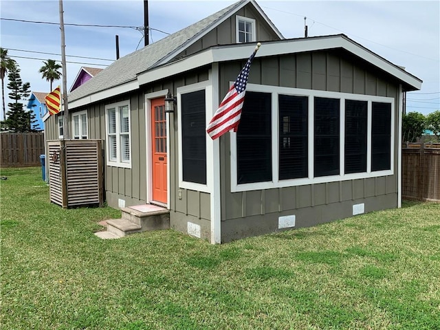 view of property exterior with a lawn