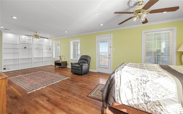 bedroom featuring ceiling fan, wood-type flooring, crown molding, and access to outside