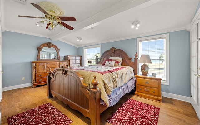 bedroom with light wood-type flooring, ceiling fan, and crown molding