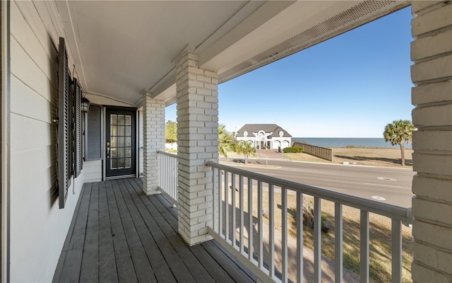 balcony featuring a water view