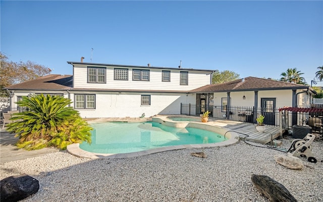 view of pool with an in ground hot tub, a patio, and central AC