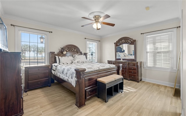 bedroom with light wood-type flooring, multiple windows, crown molding, and ceiling fan