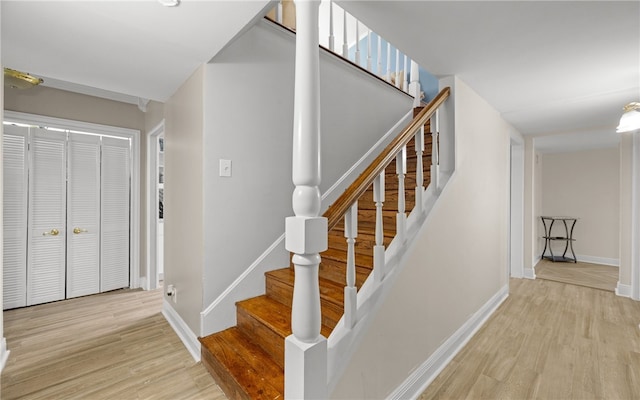 staircase with wood-type flooring