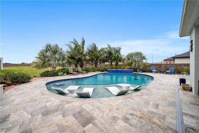 view of pool with a patio area and pool water feature