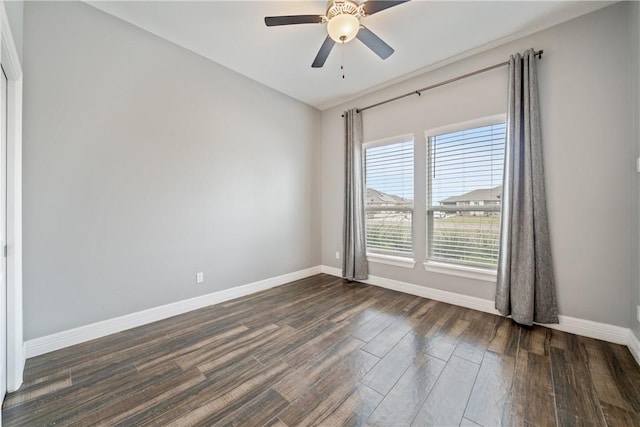 unfurnished room featuring ceiling fan and dark hardwood / wood-style flooring