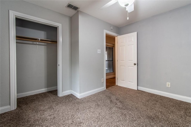 unfurnished bedroom featuring carpet floors, baseboards, visible vents, and a closet