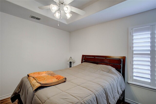 bedroom featuring hardwood / wood-style flooring and ceiling fan