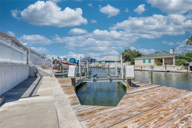 dock area with a water view