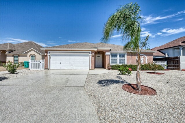 ranch-style house featuring a garage