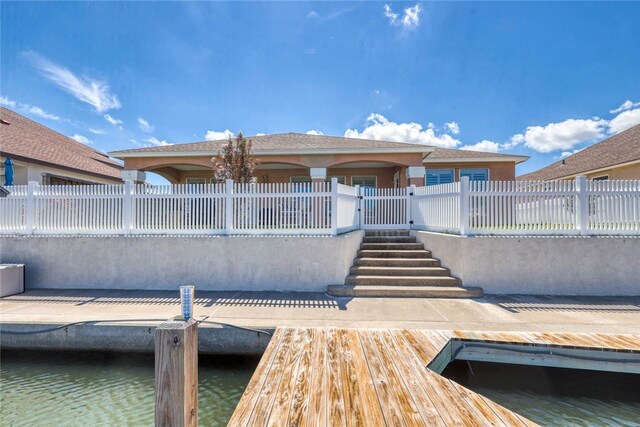 view of dock with a water view