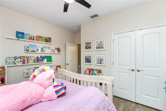 bedroom featuring ceiling fan, light wood-type flooring, and a closet