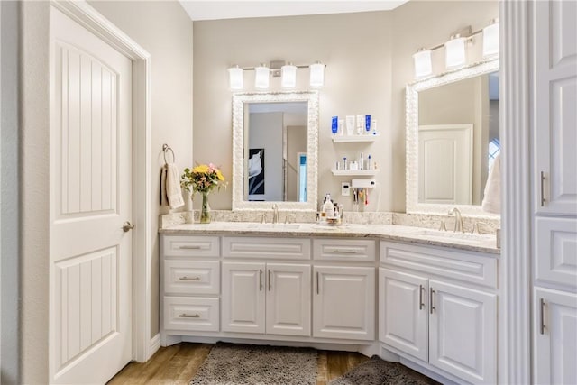 bathroom with vanity and wood-type flooring