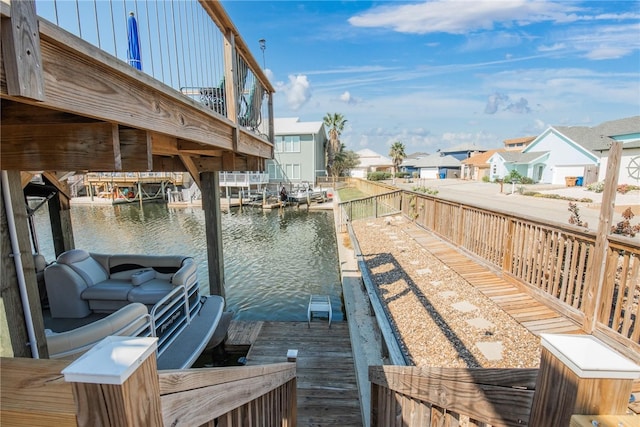 dock area with a water view