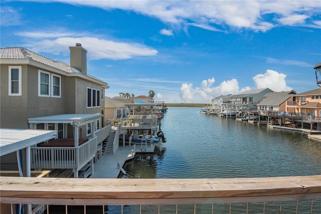 view of dock featuring a deck with water view