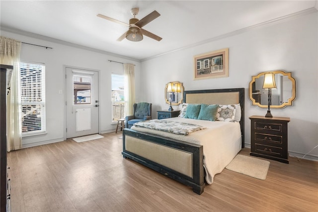 bedroom with ornamental molding, light hardwood / wood-style flooring, and ceiling fan