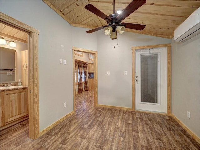 empty room featuring lofted ceiling, wooden ceiling, a sink, wood finished floors, and a wall mounted AC