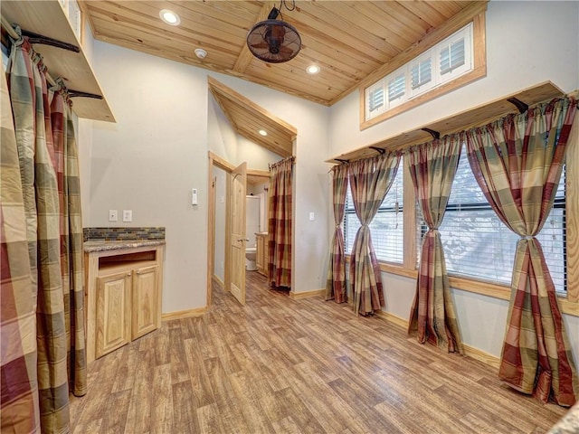 interior space with recessed lighting, light wood-style flooring, wood ceiling, vaulted ceiling, and baseboards