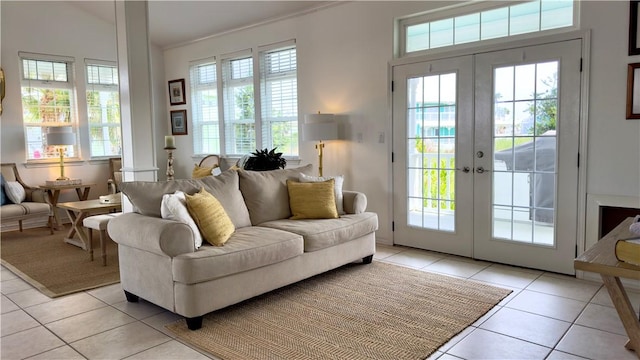 living area featuring light tile patterned floors and french doors