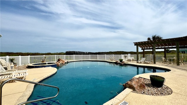 view of pool featuring a pool with connected hot tub, a patio area, fence, and a pergola