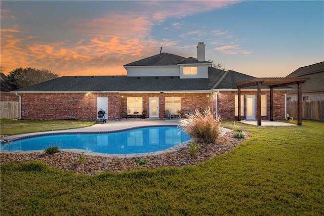 pool at dusk with a patio, a pergola, and a lawn