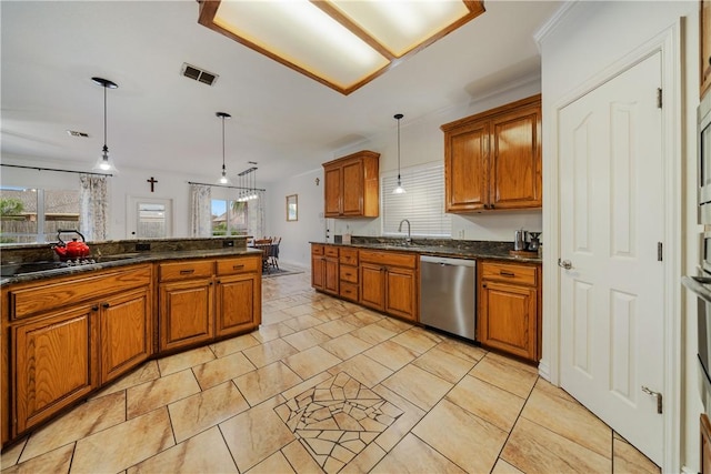 kitchen featuring sink, pendant lighting, dishwasher, and a healthy amount of sunlight