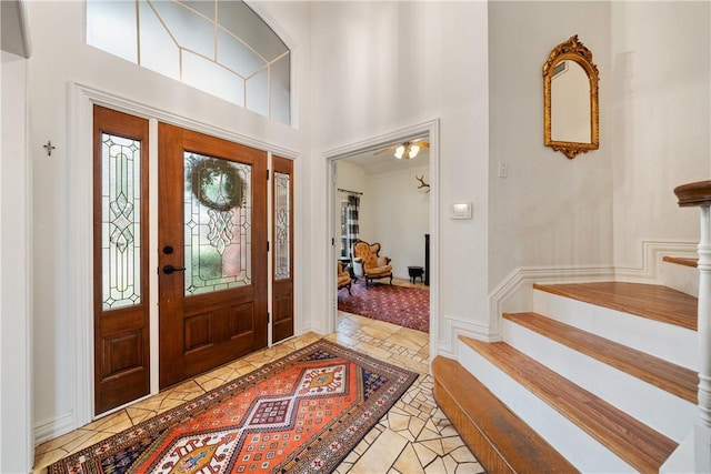 foyer with a towering ceiling