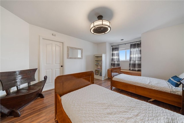 bedroom with hardwood / wood-style floors