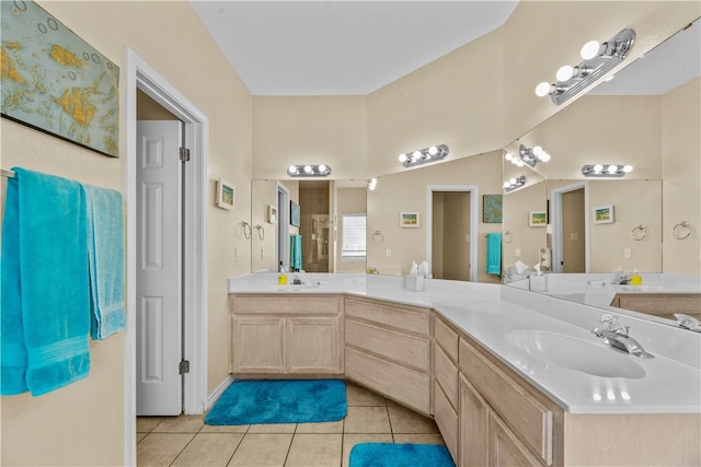 bathroom featuring tile patterned flooring and vanity